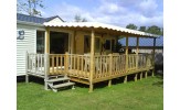 Grande terrasse avec toiture ivoire à vagues pour terrasse de mobil home